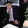 brian-in-interview-room-picking-nose.jpg